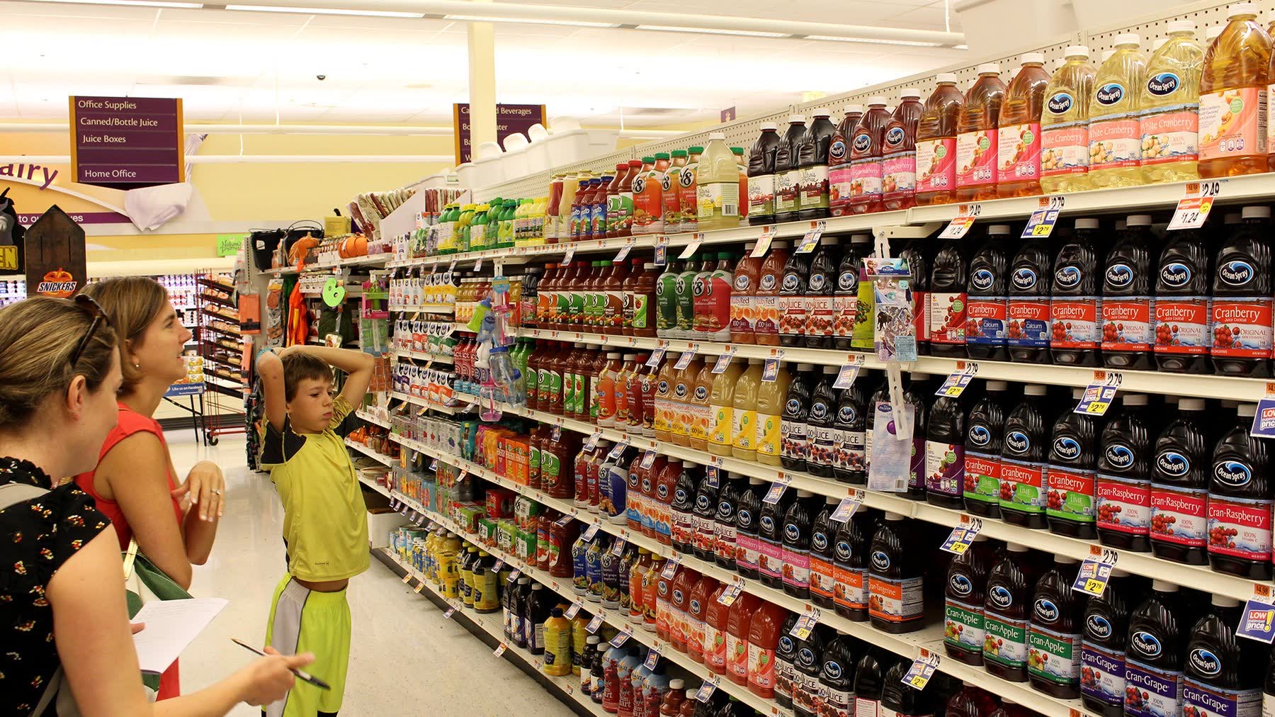 Parent and child observed in supermarket drinks aisle
