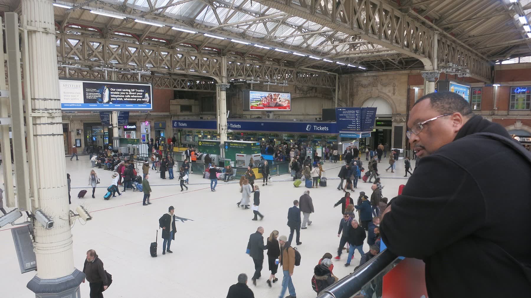 Passengers observed waiting at station concourse